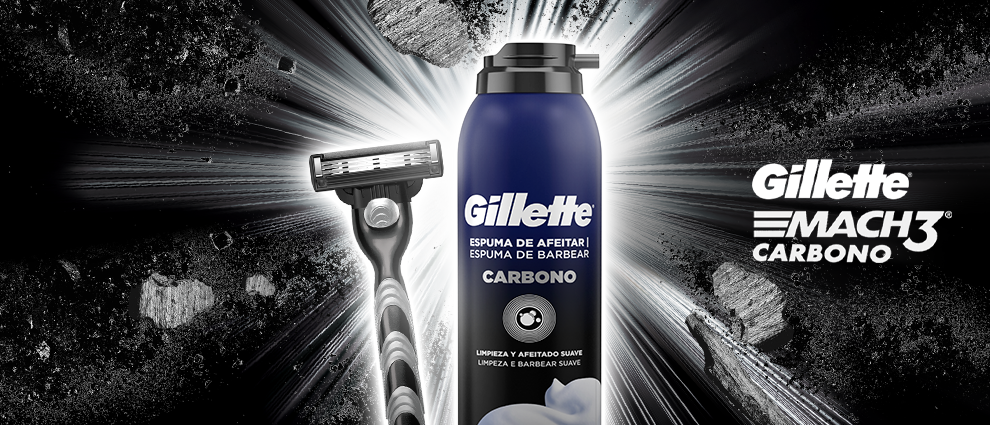 Aparelho de barbear Gillette e espuma de barbear carbono com efeito de luz brilhante ao fundo.